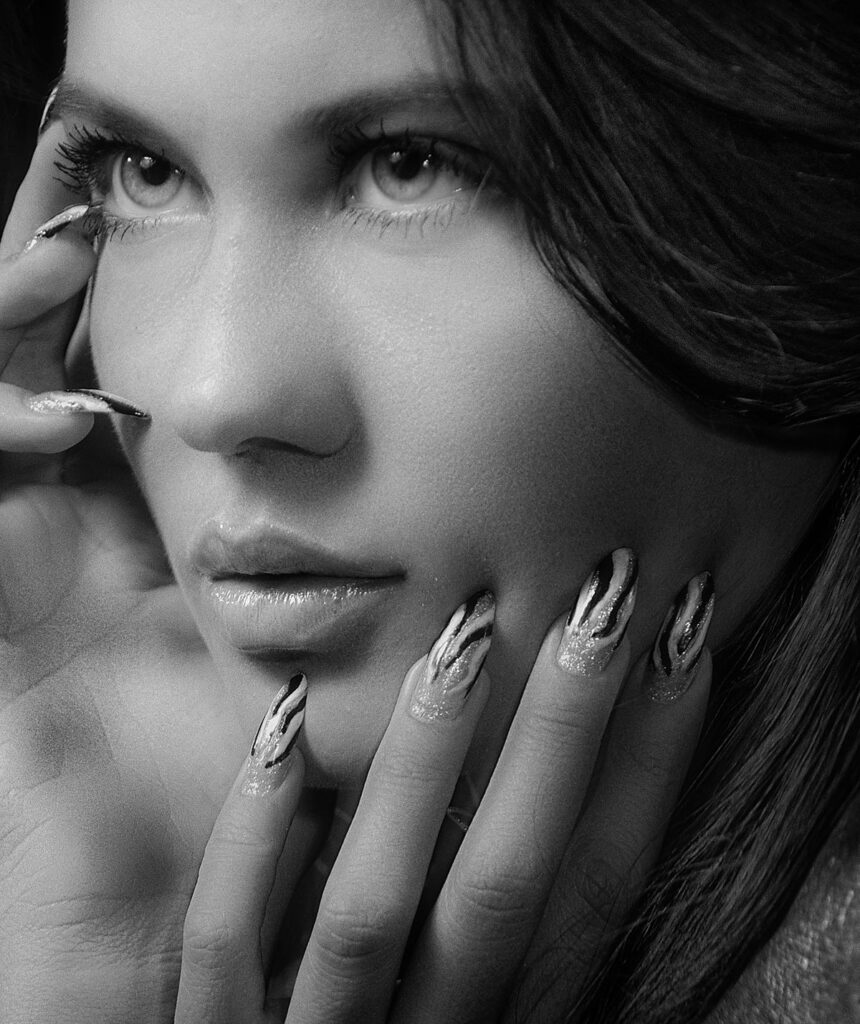 Black and white portrait with stylish nails