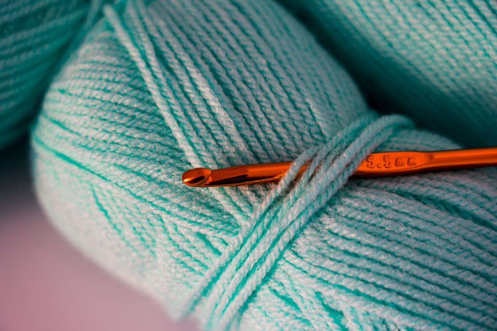 Close up photo of teal yarn