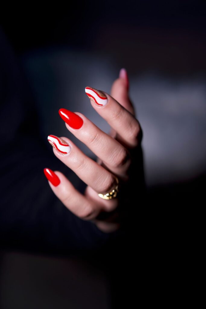 Elegant red and white manicure close up