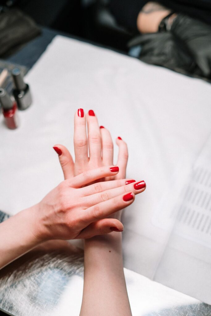 Person with red nail polish