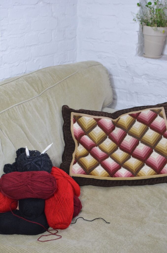 Sofa with woolen thread and knitted pillow