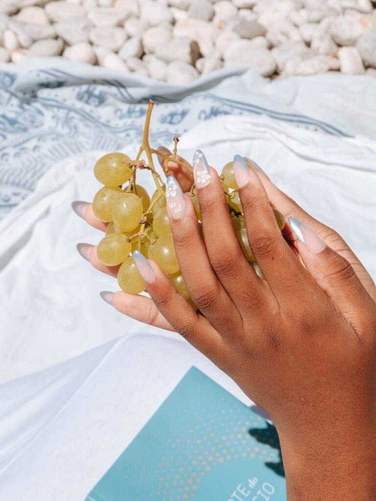 Stylish nail art in summer picnic setting