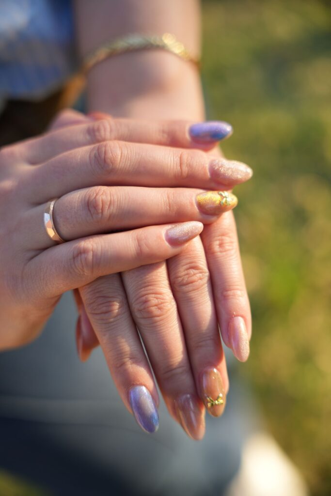 close up of stylish manicure with colorful nails